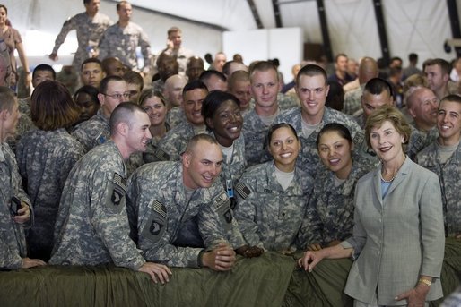 Mrs. Laura Bush poses for a photo with US troops during her visit to Bagram Air Force Base Sunday, June 8, 2008, in Bagram, Afghanistan. White House photo by Shealah Craighead