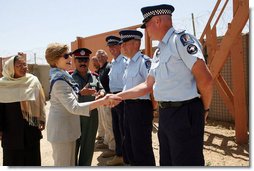 Mrs. Laura Bush greets New Zealand Police officers Sunday, June 8, 2008, during her visit to the Police Training Academy in Bamiyan, Afghanistan. Mrs. Bush traveled to Afghanistan to highlight the continued U.S. commitment to the country and its President Hamid Karzai.  White House photo by Shealah Craighead