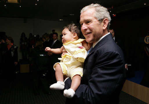 President George W. Bush smiles as he holds a baby during his visit to the United States Embassy Tuesday, June 10, 2008, in Kranj, Slovenia. White House photo by Chris Greenberg