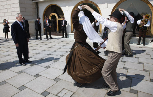 President George W. Bush watches dancers during festivities at the Lipizzaner stallion exhibition Tuesday, June 10, 2008, at Brdo Castle in Kranj, Slovenia. White House photo by Eric Draper