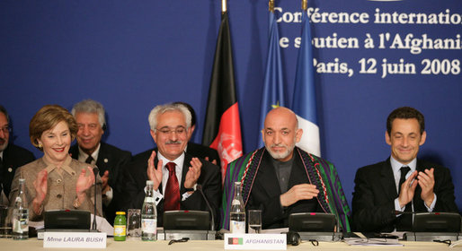 Mrs. Laura Bush joins in the applause during the International Conference in Support of Afghanistan Thursday, June 12, 2008 in Paris, where Mrs. Bush addressed the conference urging continued support for the Afghanistan people to build civic and economic institutions that can withstand the forces of oppression. Mrs. Bush is joined on the panel, from left, Afghanistan Foreign Minister Dr. Rangin Dadfar Spanta, Afghanistan President Hamid Karzai and French President Nicholas Sarkozy. White House photo by Shealah Craighead