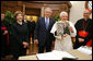 President George W. Bush and Laura Bush present Pope Benedict XVI with a framed photograph Friday, June 13, 2008, during their visit to the Vatican. The photo shows President Bush and Pope Benedict XVI together at the White House during the Pope's visit in April. White House photo by Shealah Craighead