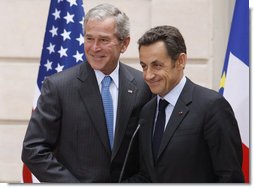 President George W. Bush and President Nicolas Sarkozy of France, shake hands following their joint press availability Saturday, June 14, 2008, in Paris.  White House photo by Eric Draper