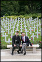 Military veterans sit on a bench at the Suresnes American Cemetery and Memorial in Paris on Saturday, June 14, 2008, awaiting the arrival of President George W. Bush. White House photo by Chris Greenberg