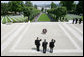 President George W. Bush is flanked by two U.S. World War II Veterans during wreath-laying ceremonies Saturday, June 14, 2008, at the Suresnes American Cemetery and Memorial in Paris. White House photo by Chris Greenberg