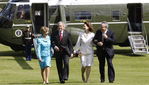 President George W. Bush and Laura Bush are met by U.S. Ambassador Robert Holmes Tuttle and his wife, Maria, Sunday, June 16, 2008, on their arrival to the ambassador's residence Winfield House in London. White House photo by Eric Draper