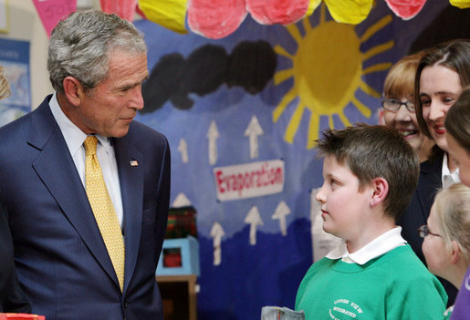 President George W. Bush speaks with a young student Monday. June 16, 2008, during his visit to the Lough Integrated Primary School in Belfast, Ireland. White House photo by Chris Greenberg