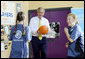 President George W. Bush participates in a basketball game Monday. June 16, 2008, during a visit to the Lough Integrated Primary School in Belfast, Ireland. White House photo by Shealah Craighead