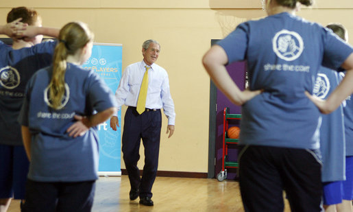 President George W. Bush speaks to members of the Peace Players basketball team Monday. June 16, 2008, during a visit to the Lough Integrated Primary School in Belfast, Ireland. White House photo by Shealah Craighead