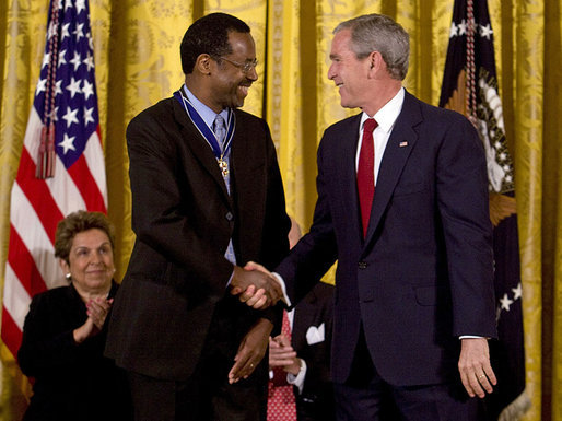 President George W. Bush shakes hands with Dr. Benjamin Carson Thursday, June 19, 2008, after presenting him with the 2008 Presidential Medal of Freedom during ceremonies in the East Room of the White House. White House photo by David Bohrer