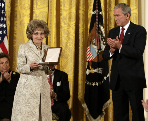 President George W. Bush leads the applause for Mrs.Tom Lantos after she received the 2008 Presidential Medal of Freedom citation in honor of her late husband, California Congressman Tom Lantos, during ceremonies Thursday, June 19, 2008, in the East Room of the White House. White House photo by David Bohrer