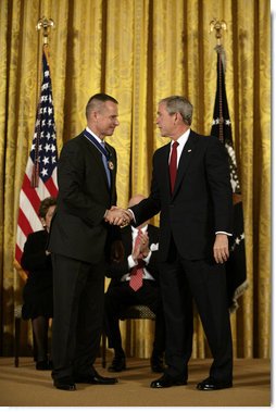 President George W. Bush shakes hands with General Peter Pace after presenting him with the Presidential Medal of Freedom Thursday, June 19, 2008, during the Presidential Medal of Freedom ceremony in the East Room at the White House. White House photo by David Bohrer