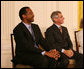 Dr. Benjamin Carson, left, seated with Dr. Anthony S. Fauci, listens Thursday, June 19, 2008, as he is announced as a recipient of the 2008 Presidential Medal of Freedom, at ceremonies in the East Room of the White House. White House photo by Shealah Craighead