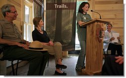 Mrs. Laura Bush listens to Rachel Allen, a student in the Service-Learning Program, as she delivers remarks during an Active Trails! event at Marsh-Billings-Rockefeller National Historical Park Monday, June 23, 2008, in Woodstock, Vt. Also shown are Rolf Diamant, Superintendent of Marsh-Billings-Rockefeller National Historical Park, and Vin Cipolla, President of the National Parks Foundation. Mr. Cipolla just announced a $50, 000 grant from the National Park Foundation to the Marsh-Billings-Rockefeller National Historical Park to connect the Forest Center to the Woodstock Trails Network. White House photo by Shealah Craighead
