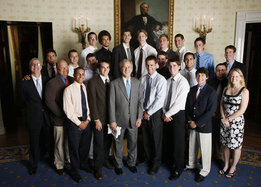 President George W. Bush stands with members of the Pennsylvania State University Men's Volleyball team on Tuesday, June 24, 2008, in the Blue Room of the White House during a photo opportunity with the 2007 and 2008 NCAA Sports Champions. White House photo by Eric Draper