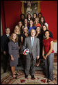 President George W. Bush poses with members of the Pennsylvania State University Women's Volleyball Team in the Red Room of the White House during the June 24, 2008, visit of the 2007 and 2008 NCAA Sports Champions. White House photo by Eric Draper