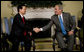 President George W. Bush exchanges handshakes with Prime Minister Nguyen Tan Dzung of the Socialist Republic of Vietnam, during their meeting Tuesday, June 24, 2008, in the Oval Office of the White House. White House photo by Eric Draper
