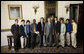 President George W. Bush stands with members of the University of Oregon Men's Cross Country, Tuesday, June 24, 2008, during a photo opportunity with the 2007 and 2008 NCAA Sports Champions. White House photo by Eric Draper