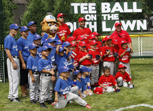 Teams participating in the opening game of the 2008 Tee Ball on the South Lawn, the Cramer Hill Little League Red Sox of Camden, N.J., and the Jose M. Rodriguez Little League Angels of Manati, Puerto Rico, pose together Monday, June 30, 2008, for a photo on the South Lawn of the White House. White House photo by Eric Draper