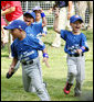 Players of the Jose M. Rodriguez Little League Angels of Manati, Puerto Rico, jubilate at the conclusion of the 2008 Tee Ball game on the South Lawn Season Opener Monday, June 30, 2008, on the South Lawn of the White House. White House photo by Joyce N. Boghosian