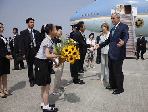 President George W. Bush and Laura Bush are welcomed on their arrival Sunday, July 6, 2008 to the New Chitose International Airport, to attend the Group of Eight Summit in Toyako, Japan. White House photo by Eric Draper