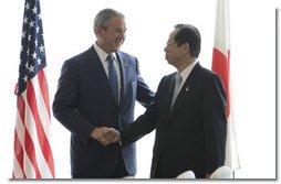 President George W. Bush and Japan's Prime Minister Yasuo Fukuda shake hands at their first meeting Sunday, July 6, 2008, at the Windsor Hotel Toya Resort and Spa in Toyako, Japan, site for this year's 2008 Group of Eight Summit.  White House photo by Eric Draper
