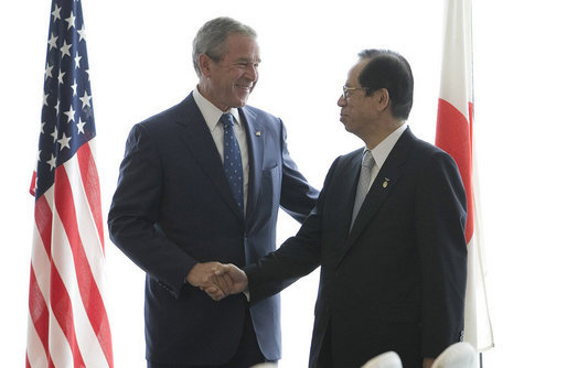 President George W. Bush and Japan's Prime Minister Yasuo Fukuda shake hands at their first meeting Sunday, July 6, 2008, at the Windsor Hotel Toya Resort and Spa in Toyako, Japan, site for this year's 2008 Group of Eight Summit. White House photo by Eric Draper