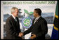 President George W. Bush and President Jakaya Kikwete exchange handshakes Monday, July 7, 2008, after meeting the media in Toyako, Japan, following the G-8 Working Session with the Africa Outreach Representatives. White House photo by Eric Draper