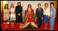 Spouses of G-8 leaders pose with a model dressed in a Junihitoe, a 12-layered ancient kimono, following a demonstration of traditional Japanese culture Monday, July 7, 2008, in Toyako, Japan. From left, the spouses are: Mrs. Margarida Uva Barroso, Mrs. Laureen Harper, Mrs. Sarah Brown, Mrs. Laura Bush, Mrs. Svetlana Medvedeva, and Mrs. Kiyoko Fukuda. White House photo by Shealah Craighead