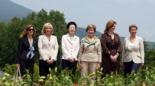 With Mt. Yoteizan as a backdrop, the G-8 Spouses pause Tuesday, July 8, 2008, for their family photo in the village of Makkari on the northern Japanese island of Hokkaido. White House photo by Shealah Craighead