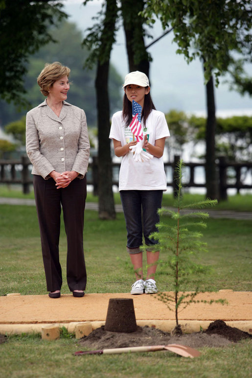 Mrs. Laura Bush stands with Natsumi Kagawa, age 11, after planting a tree at the Toyako New Mount Showa Memorial Park Wednesday, July 8, 2008, during a tree planting ceremony in Hokkaido, Japan. White House photo by Shealah Craighead