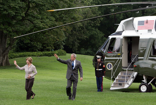 President George W. Bush and Mrs. Laura Bush wave Wednesday, July 9. 2008 on their arrival back to the White House, following their trip to the G-8 Summit in Japan. White House photo by Luke Sharrett