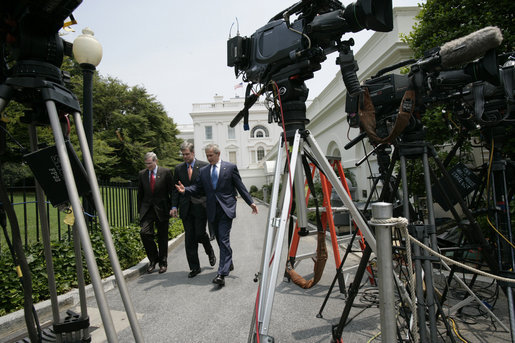 President George W. Bush walks with National Security Advisor Stephen Hadley and White House Press Secretary Tony Snow in this July 27, 2006 White House photo. The 53-year-old former spokesman died Saturday, July 12, 2008, of cancer. White House photo by Eric Draper