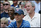 President George W. Bush and baseball Hall of Famer Frank Robinson, left, cheer on players participating in the Tee Ball on the South Lawn All-Star Game Wednesday, July 16, 2008, where the teams Eastern U.S. vs.Central U.S., and Southern U.S. vs. Western U.S., played in an afternoon doubleheader at the White House. White House photo by Chris Greenberg