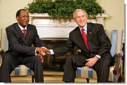 President George W. Bush shakes hands with Burkina Faso President Blaise Compaore, during a meeting Wednesday, July 16, 2008, in the Oval Office of the White House. White House photo by Joyce N. Boghosian