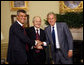 President George W. Bush shakes hands with Kosovo President Fatmir Sejdiu, center, and Kosovo Prime Minister Hashim Thaci, left, during a meeting Monday, July 21, 2008, in the Oval Office of the White House. White House photo by Eric Draper