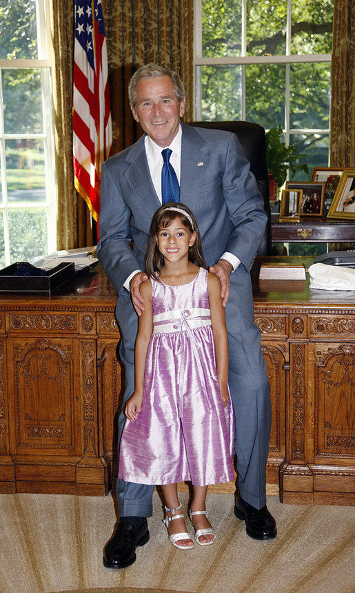 President George W. Bush poses for a photo with Catharine Aboulhouda, age 5, the 2008 March of Dimes National Ambassador, during her visit to the White House Monday, July 21, 2008, in the Oval Office. As the 2008 National Ambassador, Catharine will travel around the country with her parents, sharing her story to help other understand the seriousness of premature birth and the importance of supporting the March of Dimes' mission to help all babies be born full term and healthy. White House photo by Eric Draper