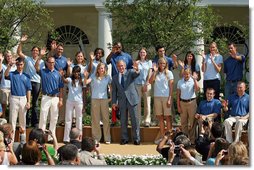 President George W. Bush joined by the members of the 2008 United States Summer Olympic Team wave to the crowd during a photo opportunity Monday, July 21, 2008, in the Rose Garden of the White House.  White House photo by Shealah Craighead