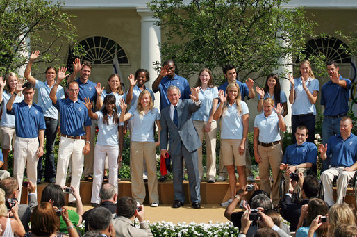 President George W. Bush joined by the members of the 2008 United States Summer Olympic Team wave to the crowd during a photo opportunity Monday, July 21, 2008, in the Rose Garden of the White House. White House photo by Shealah Craighead