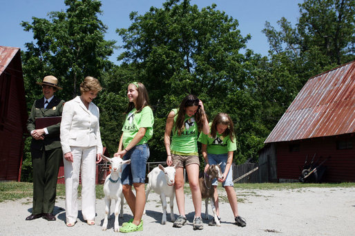 Mrs. Laura Bush meets students holding goats Monday, July 28, 2008, during a tour of the Old Goat Barn at the Carl Sandburg Home National Historic Site in Flat Rock, N.C. Mrs. Bush participated in Junior Ranger program events at the historical site and announced a $50,000 grant in support of the Junior Ranger programs. White House photo by Shealah Craighead