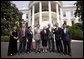 President George W. Bush poses for a photo at the South Portico entrance to the White House Tuesday, July 28, 2008, with Chinese Human Rights Activists, from left, Ciping Huang, Wei Jingsheng, Sasha Gong, Alim Seytoff, interpreter; Rebiya Kadeer, Harry Wu and Bob Fu, following their meeting at the White House. White House photo by Eric Draper