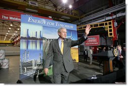 President George W. Bush acknowledges the applause of workers and guests at the conclusion of his address on energy and economic issues Tuesday, July 29, 2008 at the Lincoln Electric Company in Euclid, Ohio. White House photo by Chris Greenberg