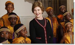 Mrs. Laura Bush meets members of the African Children's Choir Wednesday, July 30, 2008, prior to their musical performance at the White House.  White House photo by Eric Draper