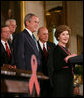  President George W. Bush is introduced to the podium by Mrs. Laura Bush Wednesday, July 30, 2008 in the East Room of the White House, prior to signing H.R. 5501, the Tom Lantos and Henry J. Hyde United States Global Leadership Against HIV/AIDS, Tuberculosis and Malaria Reauthorization Act of 2008. White House photo by Joyce N. Boghosian