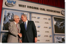 President George W. Bush greets Buck Harless, Chairman of the Board of International Industries Incorporated, Thursday, July 31, 2008 at the 2008 Annual Meeting of the West Virginia Coal Association in White Sulphur Springs, W.Va. White House photo by Joyce N. Boghosian