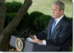 President George W. Bush addresses his remarks on Iraq to reporters Thursday morning, July 31, 2008 on the Colonnade at the White House. President Bush said it has been a month of encouraging news from Iraq, with violence down to its lowest level since the spring of 2004.  White House photo by Eric Draper
