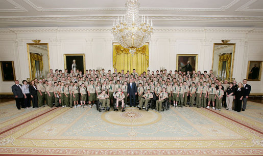 President George W. Bush poses for a photo Thursday, July 31, 2008 in the East Room of the White House, with members of the Boy Scouts and the families of Boy Scout victims of the tornado that struck the Little Sioux Scout Ranch in Little Sioux, Iowa on June 11, 2008. White House photo by Chris Greenberg