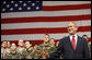 President George W. Bush waves to the crowd after arriving on stage Monday, Aug. 4, 2008, at Eielson Air Force Base, Alaska, where he addressed military personnel before continuing on to South Korea. White House photo by Eric Draper