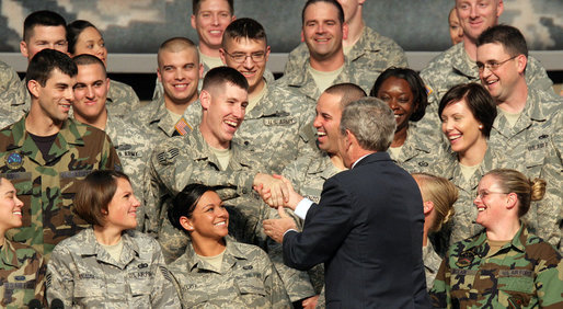 President George W. Bush greets military personnel on stage Monday, Aug. 4, 2008, at Eielson Air Force Base during a stop in Alaska en route to South Korea. White House photo by Chris Greenberg