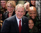 President George W. Bush poses for photos with members of the audience Monday, Aug. 4, 2008, after he delivered remarks to military personnel at Eielson Air Force Base in Alaska. White House photo by Chris Greenberg